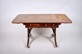 A 20th century Regency style drop end sofa table.