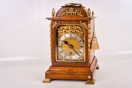 A late 19th century oak cased Georgian style table timepiece.
