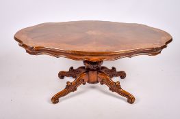A reproduction elm coffee table.