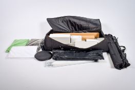 A set of as new photographic studio lights with accessories. Including stands and umbrellas, etc.