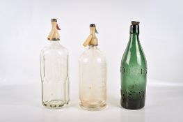 Two vintage soda syphons and a George' Bristol green beer bottle.