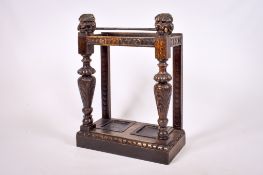 A Victorian carved oak umbrella and stick stand.