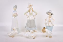 A group of six assorted Spanish porcelain figures. Including Nao ducks, a 'Dutch' girl figure, etc.