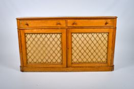 An early 20th century light oak sideboard.