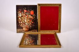 A contemporary bevelled edge mirror, gilt picture frame and floral print.