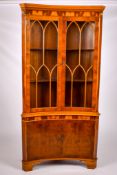 A contemporary mahogany corner cabinet.