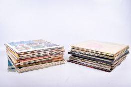 A box of assorted vintage vinyl LP records, mostly 1950s and 1960s.