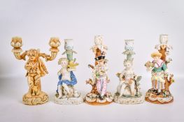 A collection of five assorted Meissen style candlesticks.