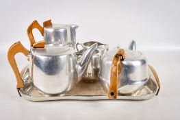 A mid-century Picquot Ware six piece aluminum tea set with matching tea tray. Largest H18cm.