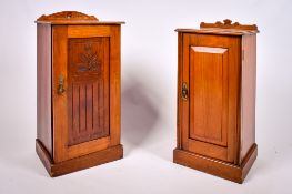 Two Victorian carved walnut pot cupboards.