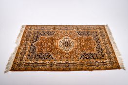 A Persian style woollen rug.