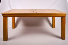A contemporary blonde oak kitchen table.