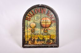 A reproduction painted wooden 'Balloon Race' sign.