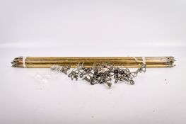 A set of twelve brass stair rods and their fixings.