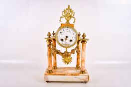 A 20th century French marble and gilt metal mantel clock.