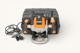 An electric Worx Plunge Router. With various attachments, within heavy duty plastic case.
