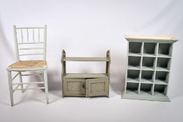 A group of three painted wooden items of furniture. Including a chair and two wall shelves.
