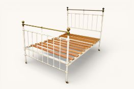 A vintage painted white brass double bed frame.