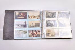 An album of approximately 160 vintage postcards.