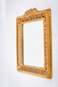 A Georgian style bevelled edge wall mirror.