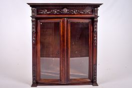 A late 19th century Flemish style carved oak glazed cabinet bookcase top.
