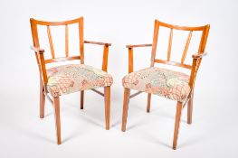 A pair of mid-century mahogany framed open armchairs.