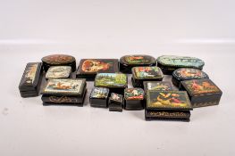 A collection of Russian lacquered paper mache boxes.