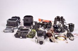 An assortment of vintage film cameras and accessories.