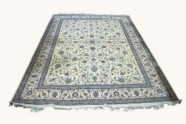A large Persian style wool rug on a cream ground.