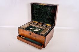 A Victorian rosewood vanity case with plated items inside.