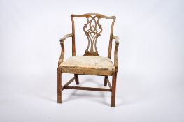 A George III 18th century Chippendale style mahogany open armchair.