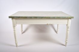 A painted kitchen table with white base and green top.
