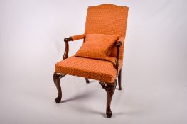 A reproduction mahogany framed armchair.