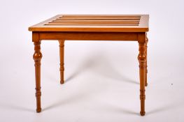 A wooden luggage rack.