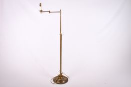 A 20th century brass articulated arm floor standard lamp.