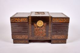 An Oriental carved camphor wood blanket box.