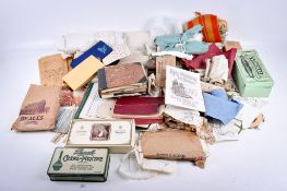 An assortment of early-mid 20th century sewing materials and tools.