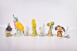 A collection of eight assorted ceramic bird ornaments. Including five Beswick and three Nao.