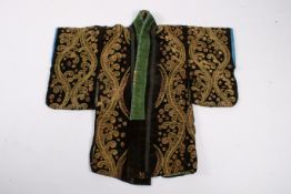 A black velvet long sleeved robe, possibly Turkish.