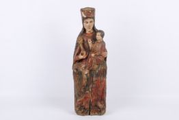 A wood and polychrome carving of Madonna and Child.