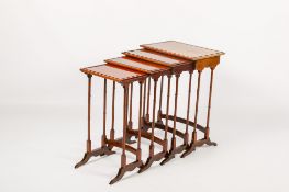 A 20th century nest of four mahogany occasional tables.