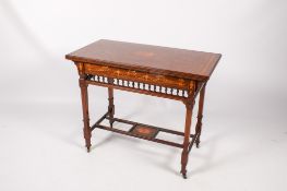 A late Victorian inlaid mahogany fold over card table.