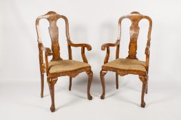 A pair of 19th century Dutch walnut and marquetry inlaid armchairs.