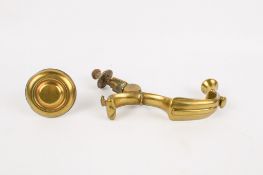 A late Georgian or early William IV brass door knocker and strike plate.