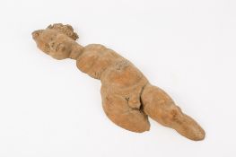 A carved wooden figure of a cherub. The head in a profile pose, with a flat back, H44cm.