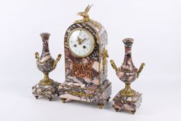 A late 19th century French marble mantel clock garniture set.