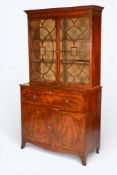 A 19th century mahogany veneered secretaire bookcase bureau cabinet.
