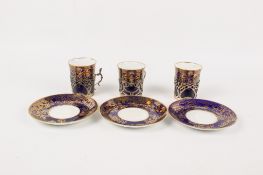 Three Spode Copeland's China of England coffee cups and saucers.