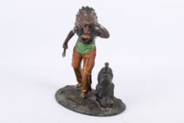 A 1920's cold painted spelter table lighter modelled as a Native American holding an axe.