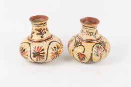 A pair of clay pots, possibly Native American.